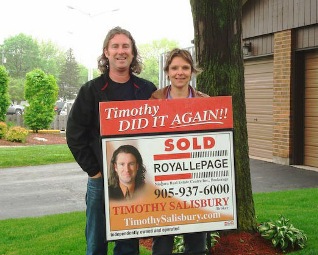 timothy-and-laura-with-sold-sign.jpg